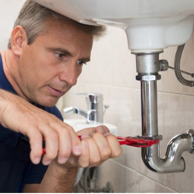 plumber-fixing-sink